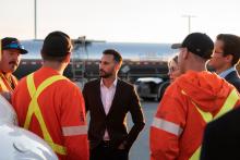 Minister of Energy and Electrification, Stephen Lecce, greets Hydro One workers crossing the border to restore power after Hurricane Helene