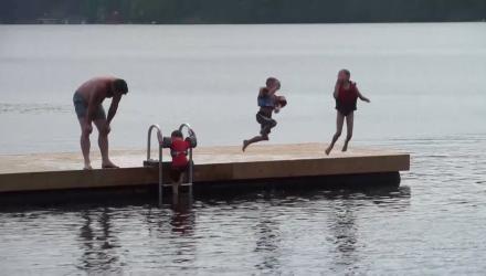 Kids jumping into lake